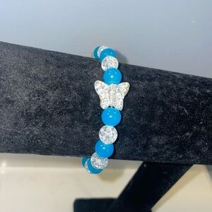 Handmade blue and crackle bead bracelet with butterfly charm